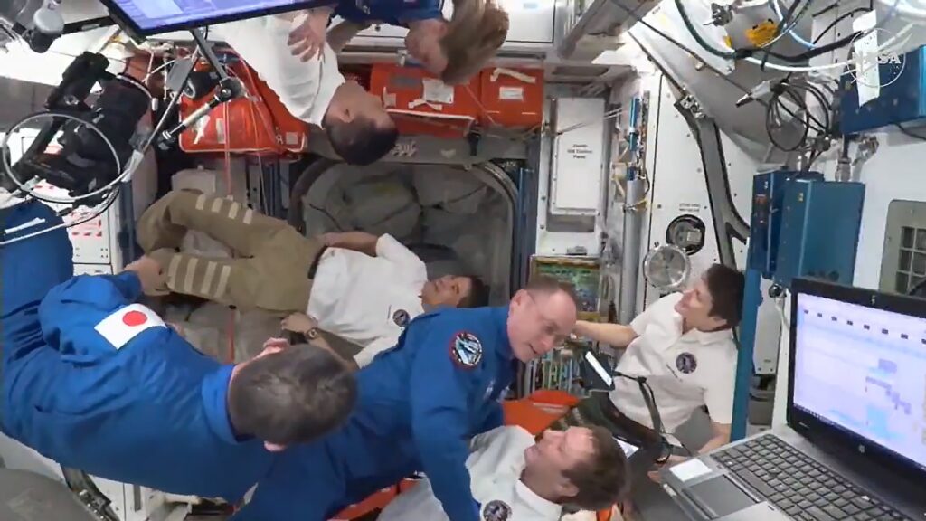 The four Crew-11 members are greeted by the seven-member Expedition 73 crew aboard the International Space Station.NASA+