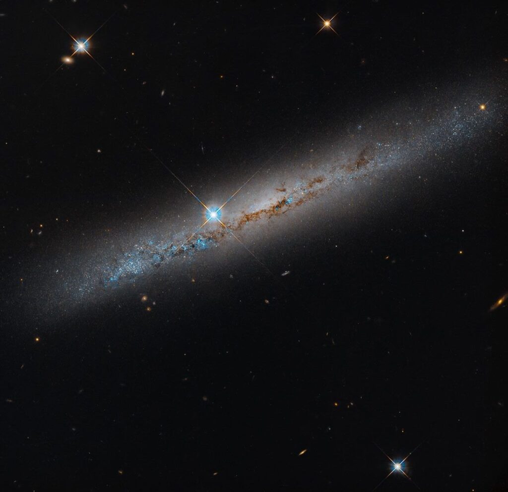 Hubble images a dust-lined galaxy, one of 111 done in a 260-galaxy survey