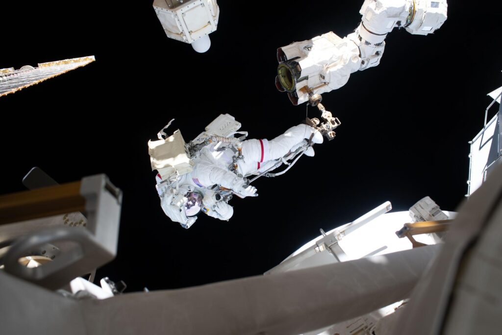 Astronaut Anil Menon attached to the Canadarm2 robotic arm during the Aug. 25 spacewalk to install a high-speed antenna