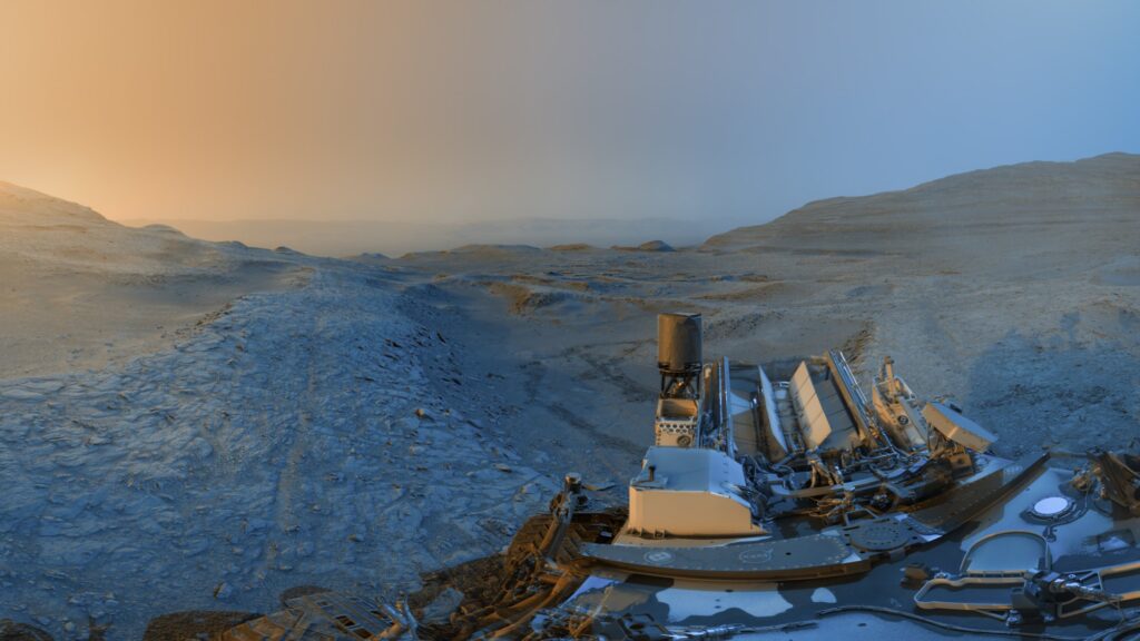 Curiosity postcard panorama merging morning and afternoon views from a boxwork ridge on Mount Sharp