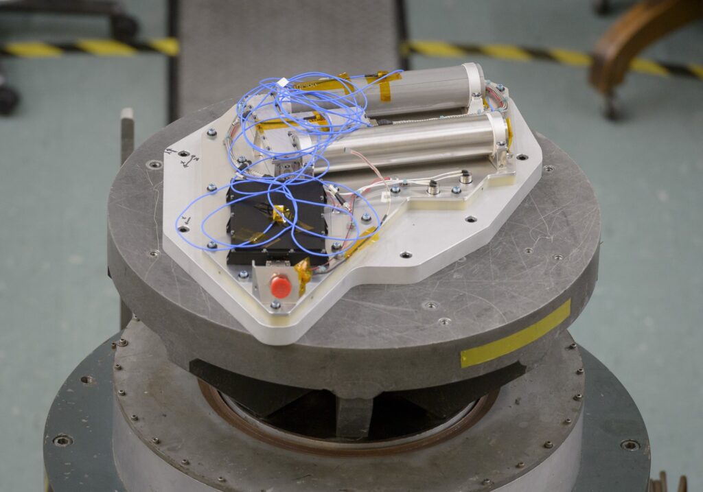 Researchers at NASA's Ames Research Center vibration-test the Neutron Spectrometer System, an instrument for the VIPER Moon rover.