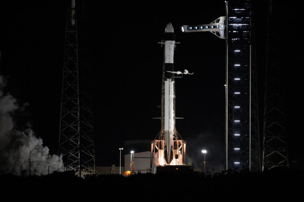 A SpaceX Falcon 9 rocket on the pad during a prelaunch engine firing test (earlier mission)