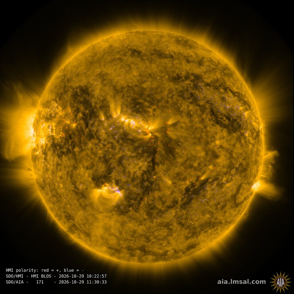 The Sun's corona in extreme ultraviolet light overlaid with a magnetogram of its magnetic field