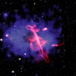 Treble Clef radio shape traced to a black hole outburst and a cluster collision