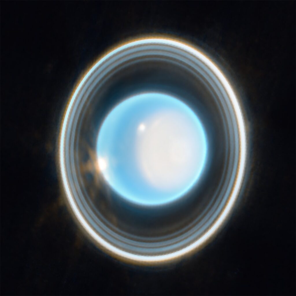 Webb near-infrared image of Uranus showing 11 of its 13 rings around the tilted planet