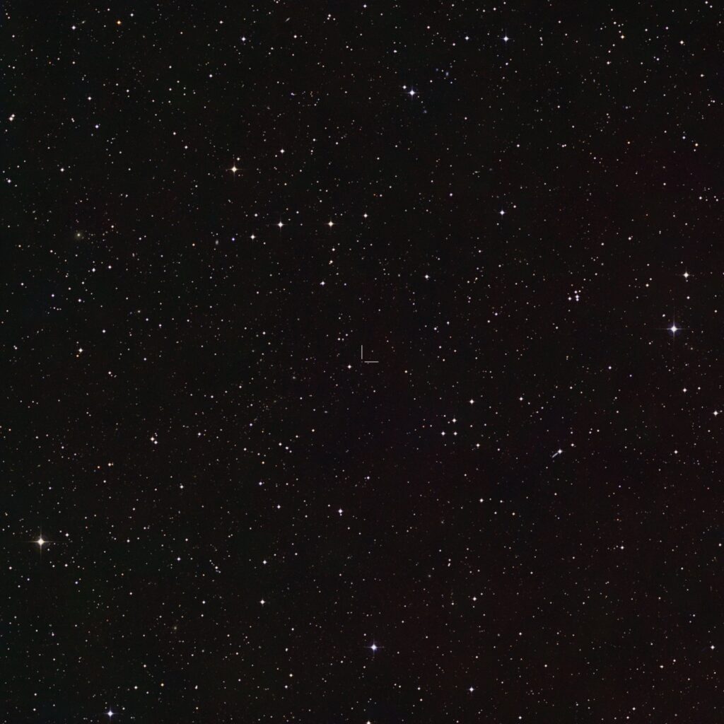 Wide-field view of the sky around the white dwarf J1328−1450, marked at the centre